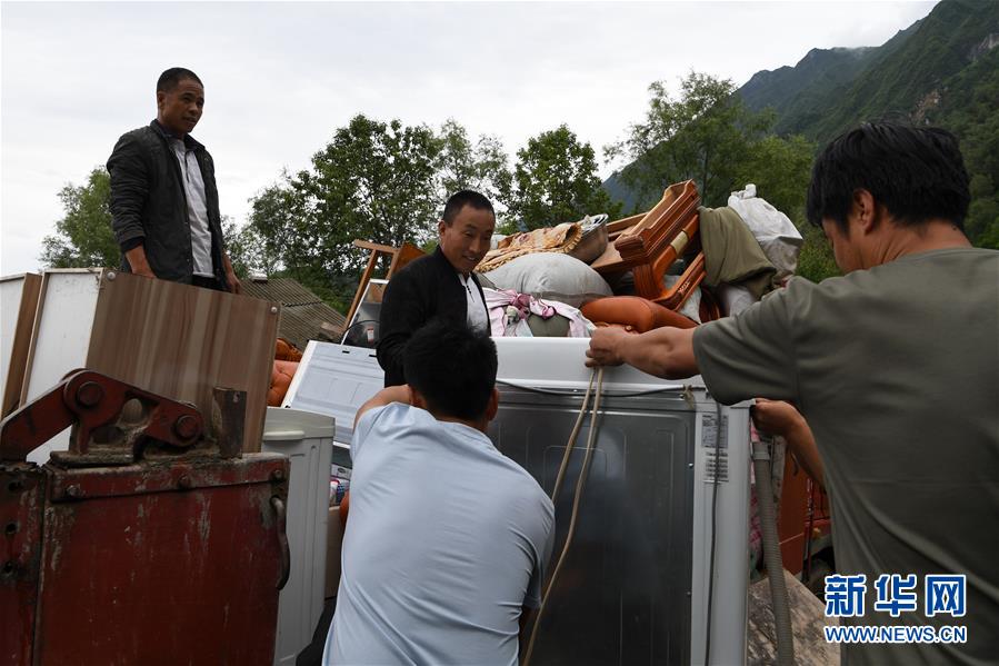 （新華全媒+）（9）千里“挪窩”，踏實開啟新生活